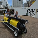 Scientists check a glider on the BIOS dock as part of the MAGIC program